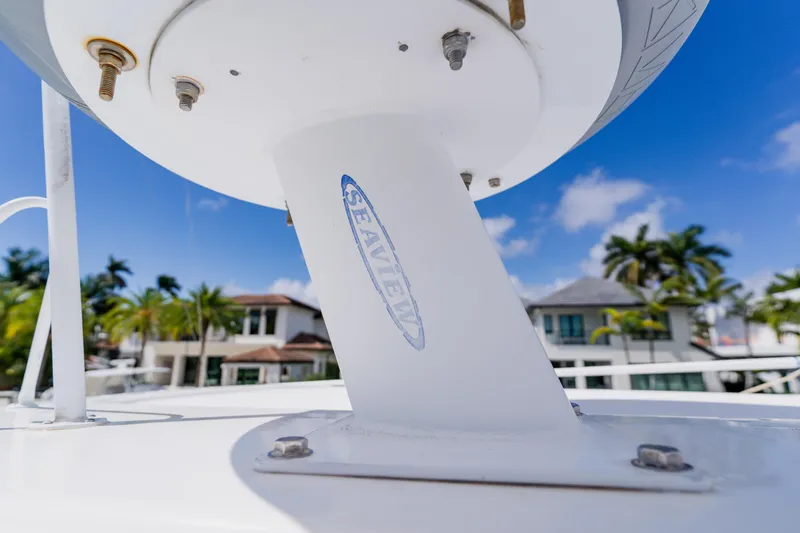 Slide: The Image of Close-up of a 2003 Wellcraft 400 Coastal boat radar mount with blue sky background. - 73