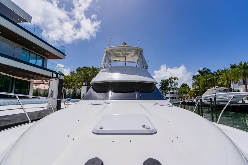 Slide: The Image of 2003 Wellcraft 400 Coastal yacht docked near modern waterfront home. - 74