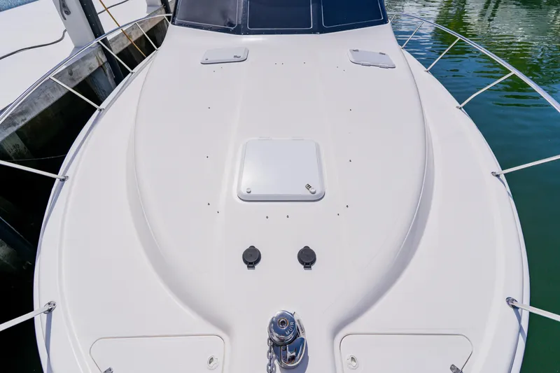 Slide: The Image of 2003 Wellcraft 400 Coastal boat deck, featuring sleek design and sturdy railings. - 75