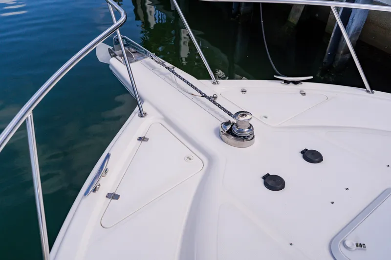 Slide: The Image of Bow of 2003 Wellcraft 400 Coastal boat with anchor chain and railing. - 78