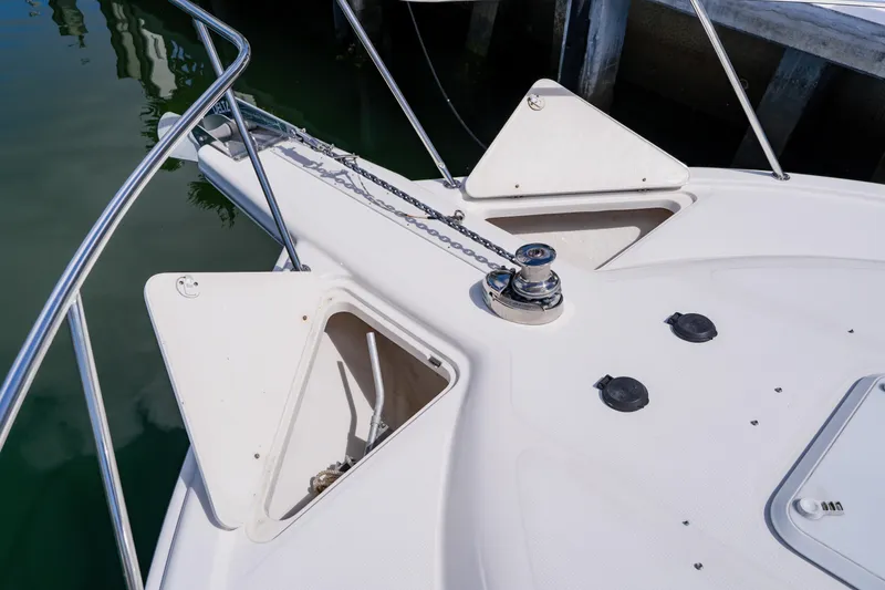Slide: The Image of Bow of 2003 Wellcraft 400 Coastal boat with anchor chain and storage compartments. - 80
