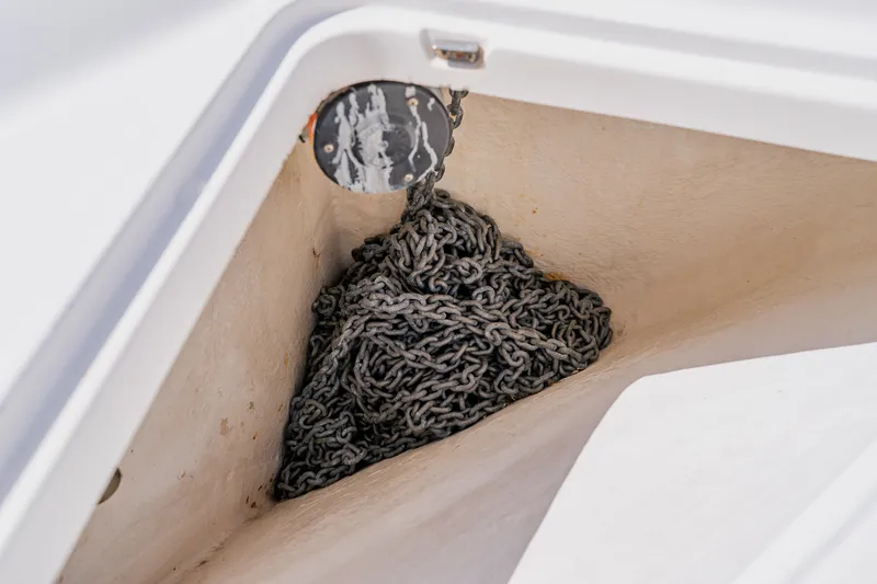 Slide: The Image of Anchor chain storage on 2003 Wellcraft 400 Coastal boat. - 81