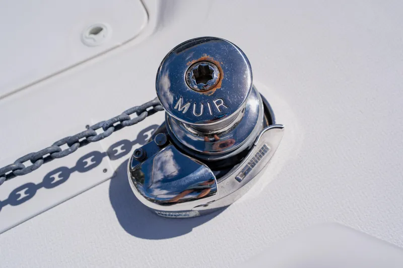Slide: The Image of Chrome winch on 2003 Wellcraft 400 Coastal boat deck with chain detail. - 82