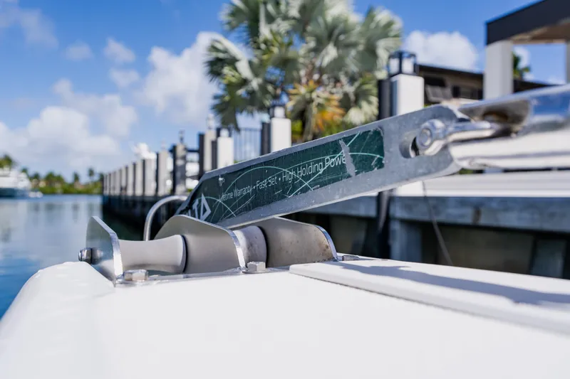 Slide: The Image of Close-up of a 2003 Wellcraft 400 Coastal boat anchor mechanism at a marina. - 83