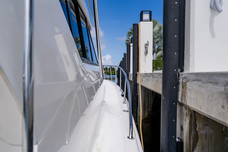 Slide: The Image of Side view of 2003 Wellcraft 400 Coastal yacht docked at marina. - 86