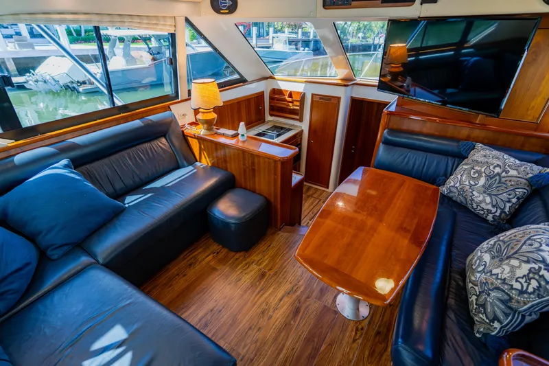 Slide: The Image of Luxurious interior of 2003 Wellcraft 400 Coastal yacht with leather seating and wooden accents. - 91