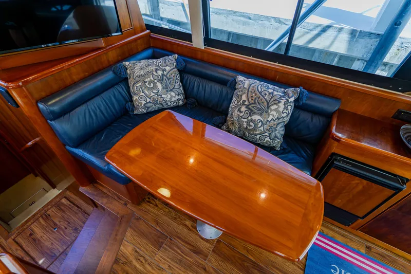 Slide: The Image of Luxurious interior of 2003 Wellcraft 400 Coastal yacht with plush seating and elegant wood table. - 92