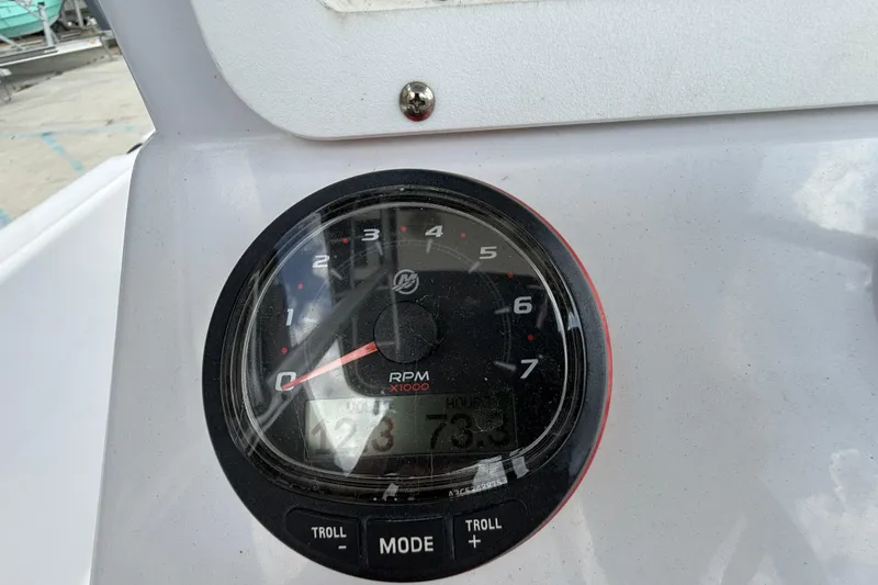 Slide: The Image of Close-up of a 2005 Champion 22 Bay Champ boat tachometer displaying RPM and hours. - 17