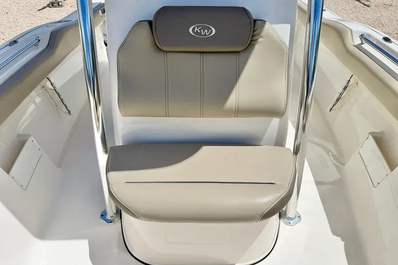 Slide: The Image of 2024 Key West 239 FS boat seat with beige upholstery and chrome accents. - 14