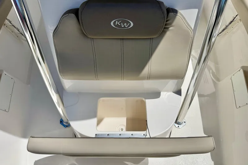 Slide: The Image of 2024 Key West 239 FS boat seat with storage compartment, featuring beige upholstery and chrome accents. - 15