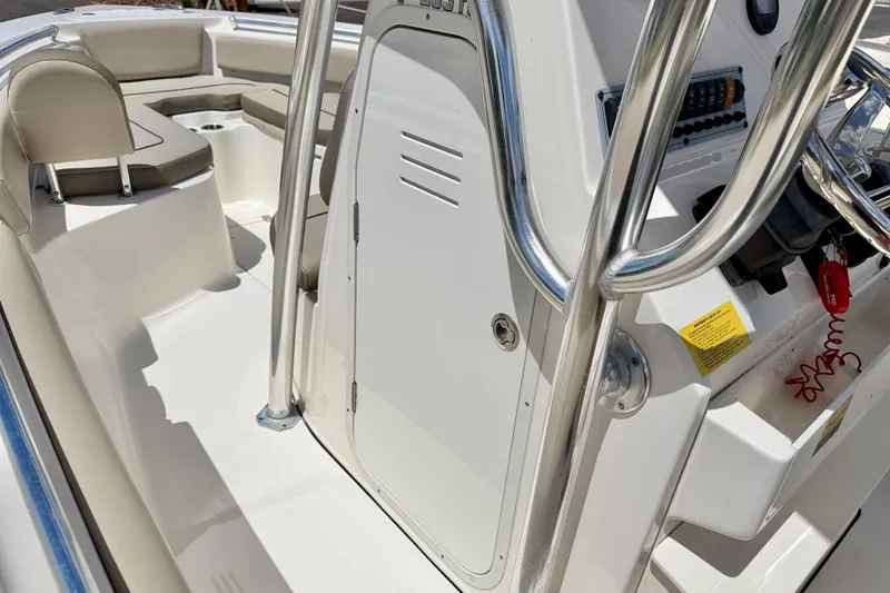 Slide: The Image of 2024 Key West 239 FS boat interior with seating and control panel. - 27