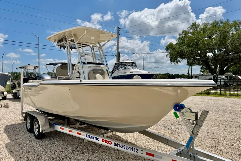 Slide: The Image of 2024 Key West 239 FS boat on trailer under clear blue sky. - 3