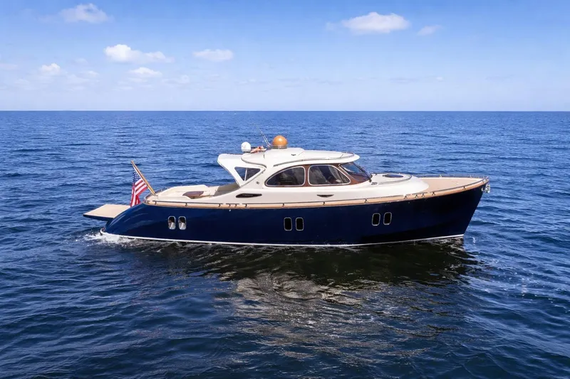 Slide: The Image of Luxurious 2012 Zeelander 44 yacht cruising on open sea under clear blue sky. - 1