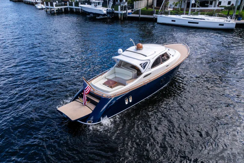 Slide: The Image of 2012 Zeelander 44 yacht cruising on a serene waterway, showcasing elegant design and luxury. - 3