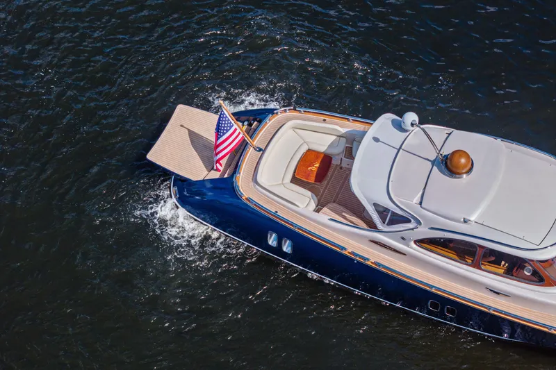 Slide: The Image of Aerial view of 2012 Zeelander 44 yacht cruising on water with American flag. - 5