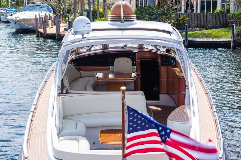 Slide: The Image of Luxurious 2012 Zeelander 44 yacht with elegant interior and American flag, docked by the water. - 7