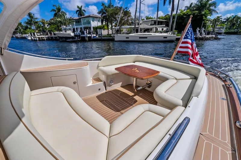 Slide: The Image of Luxurious 2012 Zeelander 44 yacht with elegant seating and American flag on a sunny day. - 9