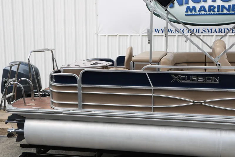 Slide: The Image of 2014 Xcursion X23F pontoon boat with Yamaha outboard motor, docked at marina. - 12