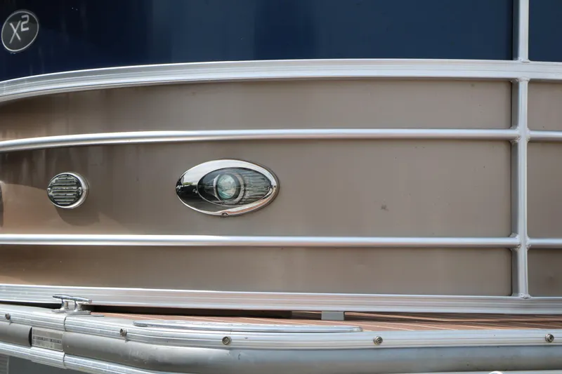 Slide: The Image of 2014 Xcursion X23F pontoon boat exterior with sleek metallic detailing. - 15