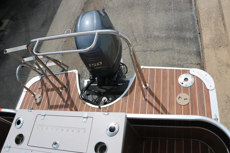 Slide: The Image of 2014 Xcursion X23F boat with Yamaha 150 engine and wooden deck. - 21