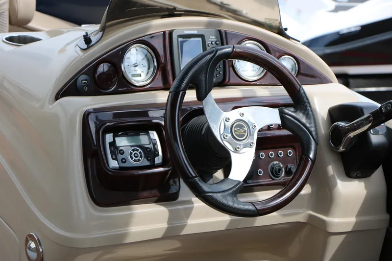 Slide: The Image of Steering console of 2014 Xcursion X23F boat with gauges and controls. - 31