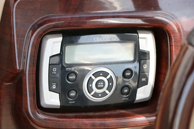 Slide: The Image of Clarion audio system in 2014 Xcursion X23F boat dashboard. - 33