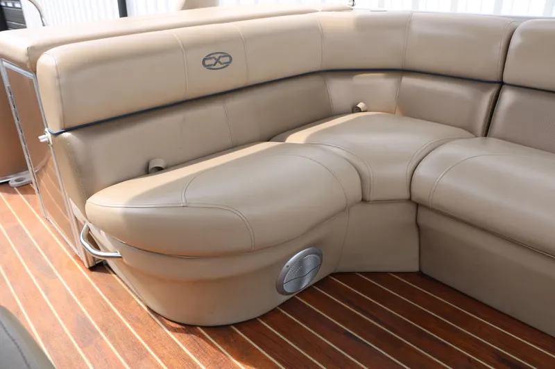 Slide: The Image of Luxurious beige seating on 2014 Xcursion X23F boat with wooden flooring. - 35