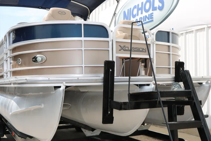Slide: The Image of 2014 Xcursion X23F pontoon boat at Nichols Marine dealership. - 4