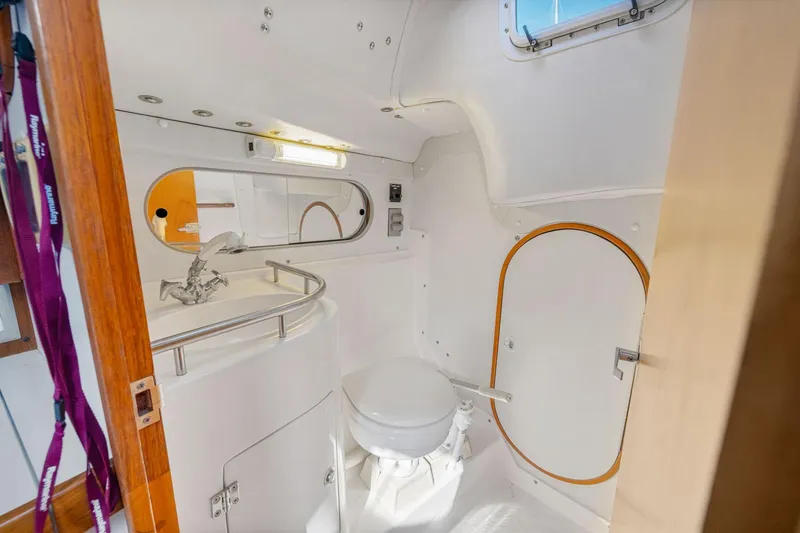 Slide: The Image of Interior of 2005 J Boats J/124 yacht bathroom with compact design and modern fixtures. - 14