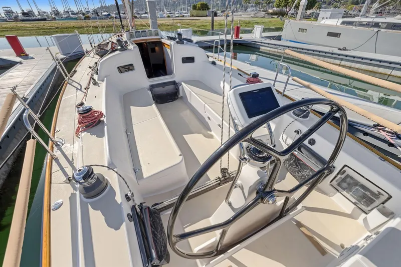 Slide: The Image of Cockpit of 2005 J Boats J/124 sailboat with steering wheel and navigation equipment. - 20