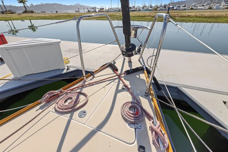 Slide: The Image of Bow view of 2005 J Boats J/124 sailboat docked, featuring deck and rigging details. - 24