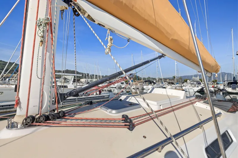 Slide: The Image of 2005 J Boats J/124 sailboat deck with rigging in marina setting. - 25
