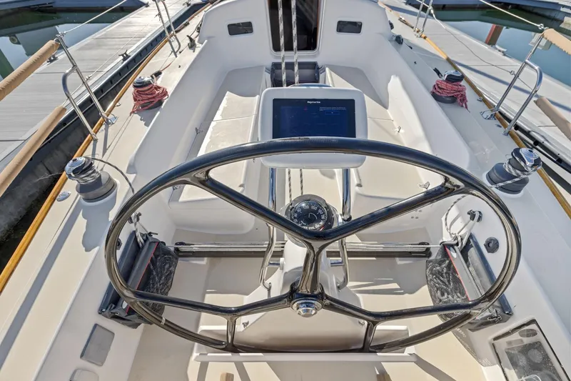 Slide: The Image of Cockpit of 2005 J Boats J/124 sailboat with steering wheel and navigation equipment. - 28
