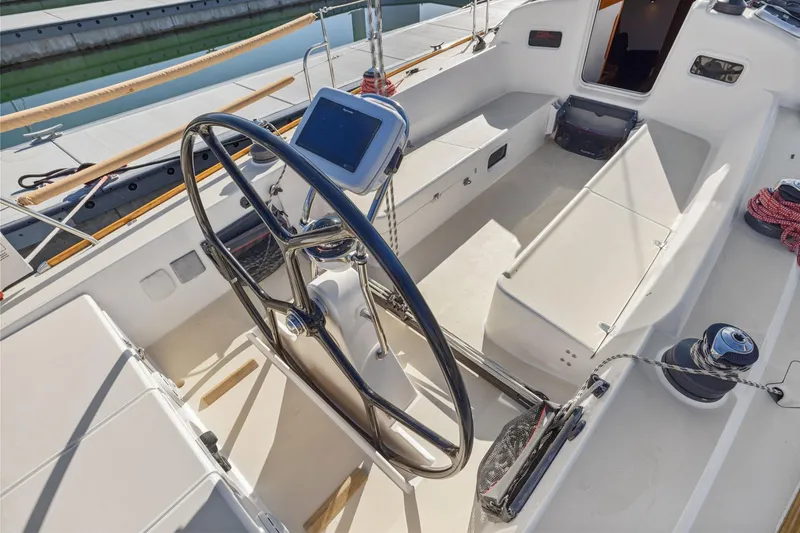 Slide: The Image of Cockpit of 2005 J Boats J/124 sailboat with steering wheel and navigation equipment. - 33