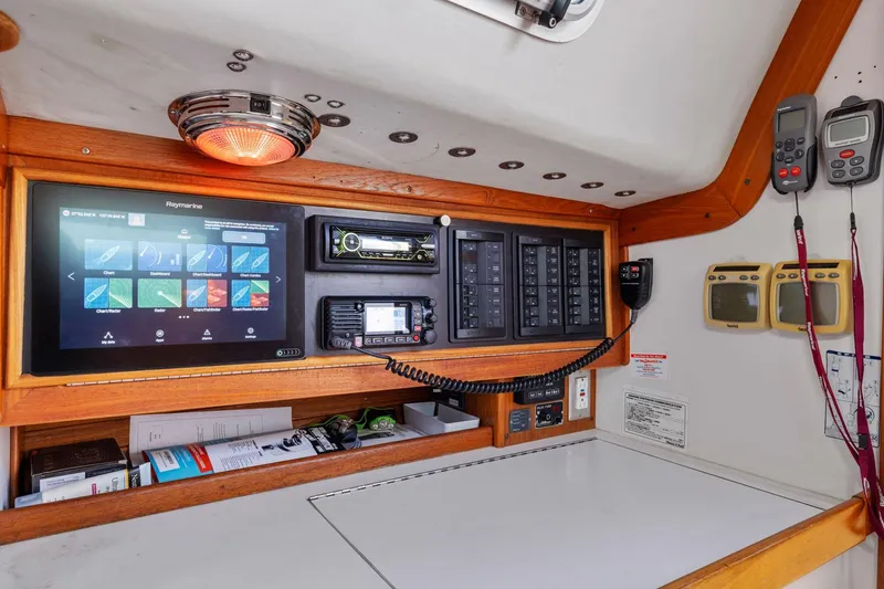 Slide: The Image of Navigation station of 2005 J Boats J/124 with electronic displays and communication equipment. - 35