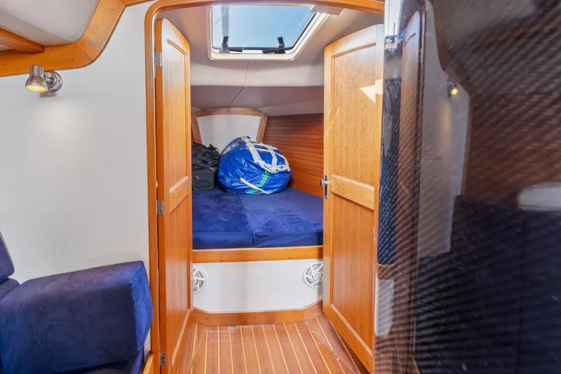 Slide: The Image of Interior cabin of 2005 J Boats J/124 sailboat with wooden finish and skylight. - 37