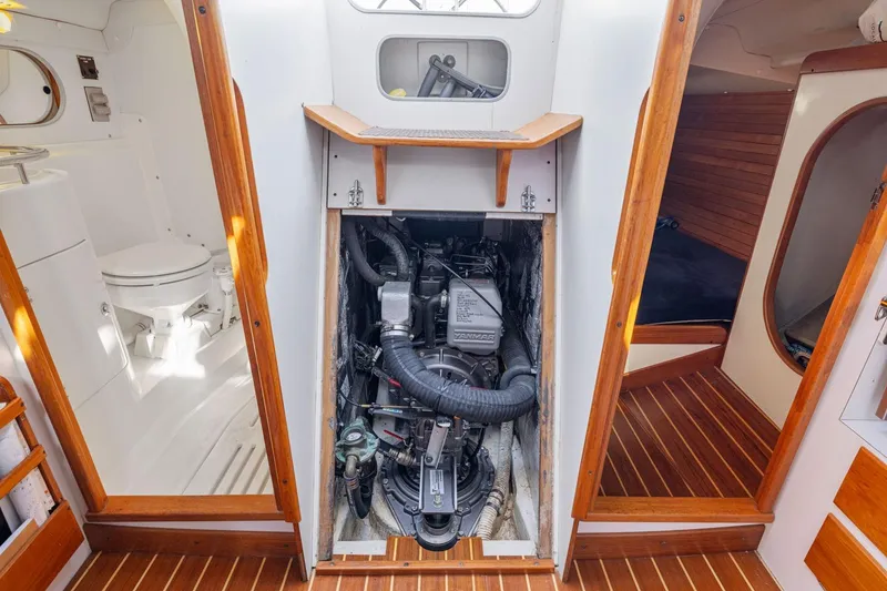 Slide: The Image of Engine compartment of a 2005 J Boats J/124 sailboat, featuring a Yanmar engine. - 4