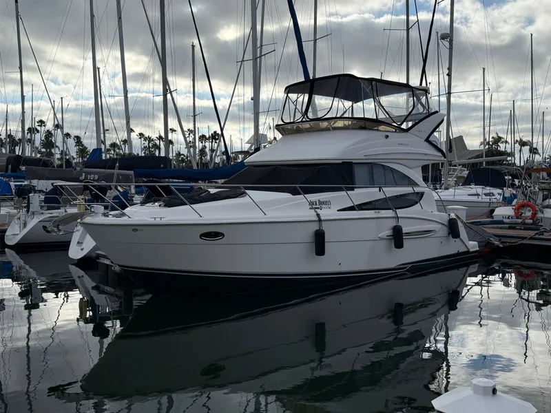 Slide: The Image of 2008 Meridian 341 Sedan yacht docked in marina, cloudy sky. - 3