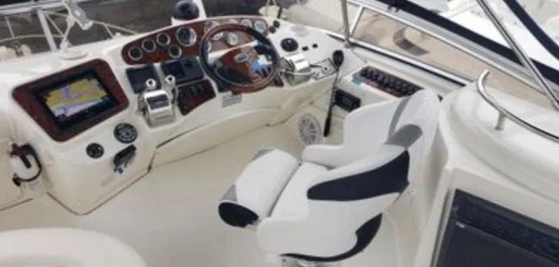 Slide: The Image of Interior of a 2008 Meridian 341 Sedan boat with helm console. - 9
