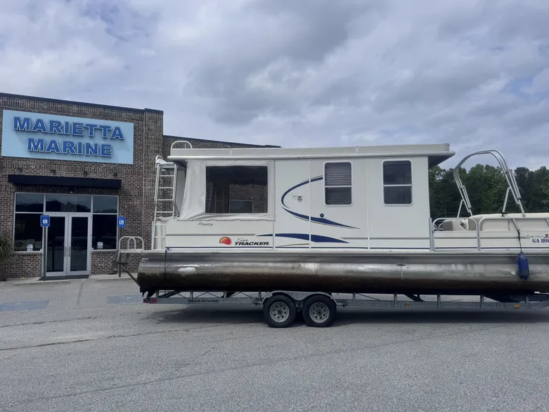 Slide: The Image of Sun Tracker Party Cruiser 32 at Marietta Marine, 2008 model with trailer. - 3