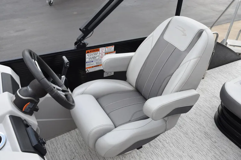 Slide: The Image of Captain's chair and steering wheel of 2021 Bennington 24 SSBX pontoon boat. - 10