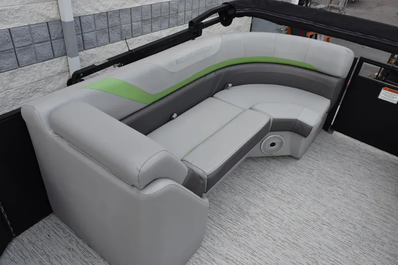 Slide: The Image of 2021 Bennington 24 SSBX boat interior with gray and green seating. - 12