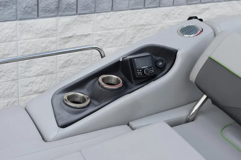 Slide: The Image of 2021 Bennington 24 SSBX boat interior with cup holders and control panel. - 17