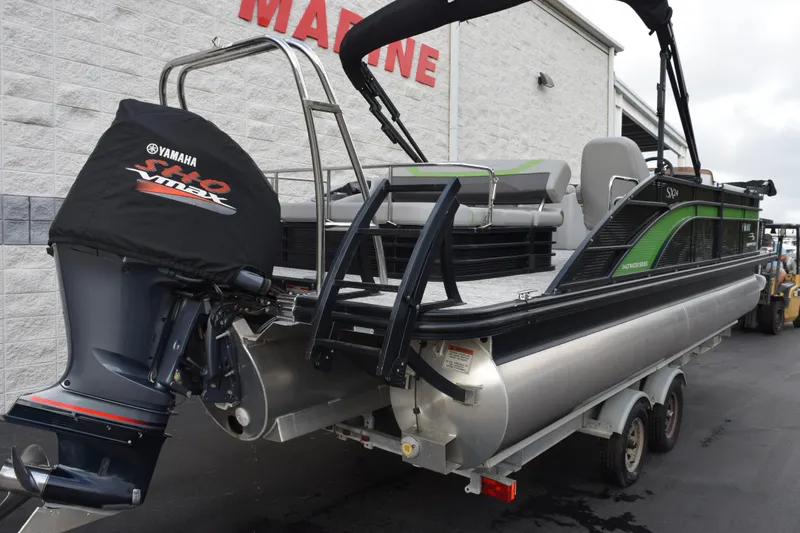 Slide: The Image of 2021 Bennington 24 SSBX pontoon boat with Yamaha VMAX engine, parked on trailer. - 3