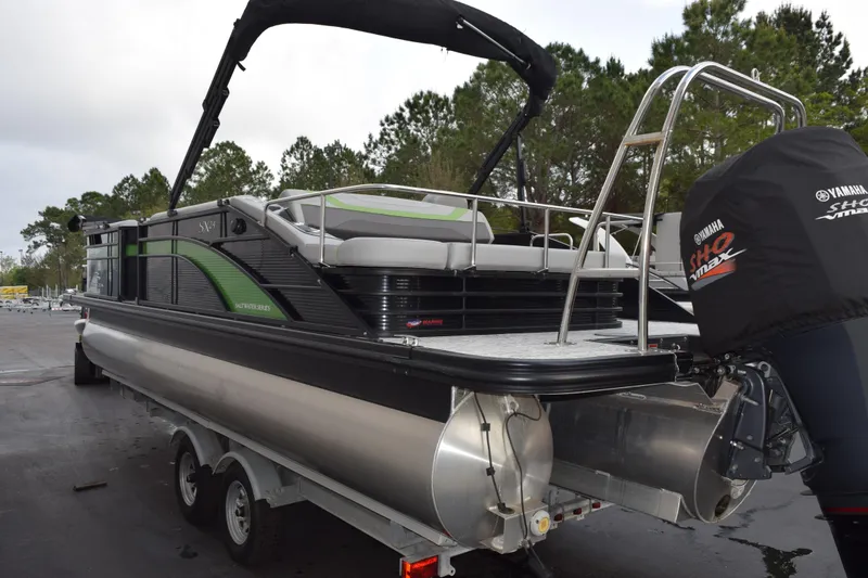 Slide: The Image of 2021 Bennington 24 SSBX pontoon boat with Yamaha engine on trailer. - 5
