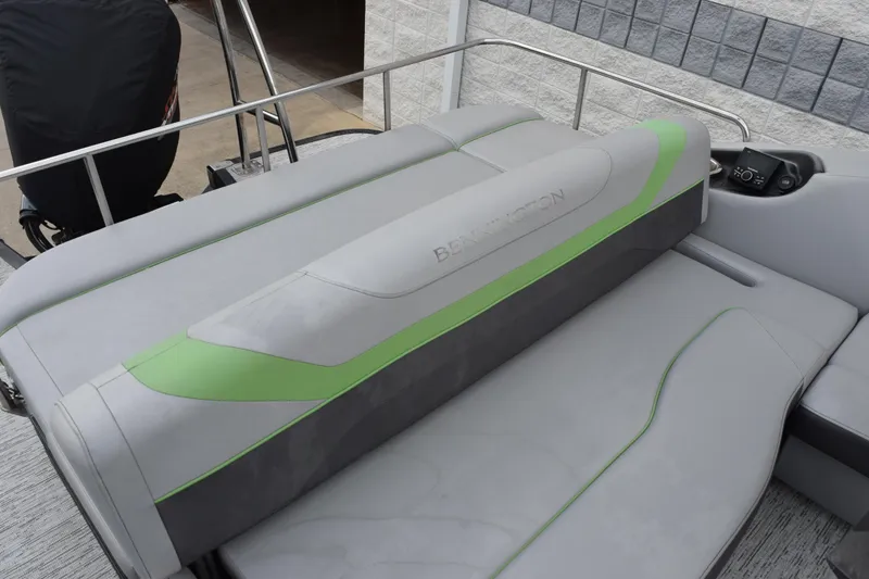 Slide: The Image of 2021 Bennington 24 SSBX boat interior with gray and green seating. - 7