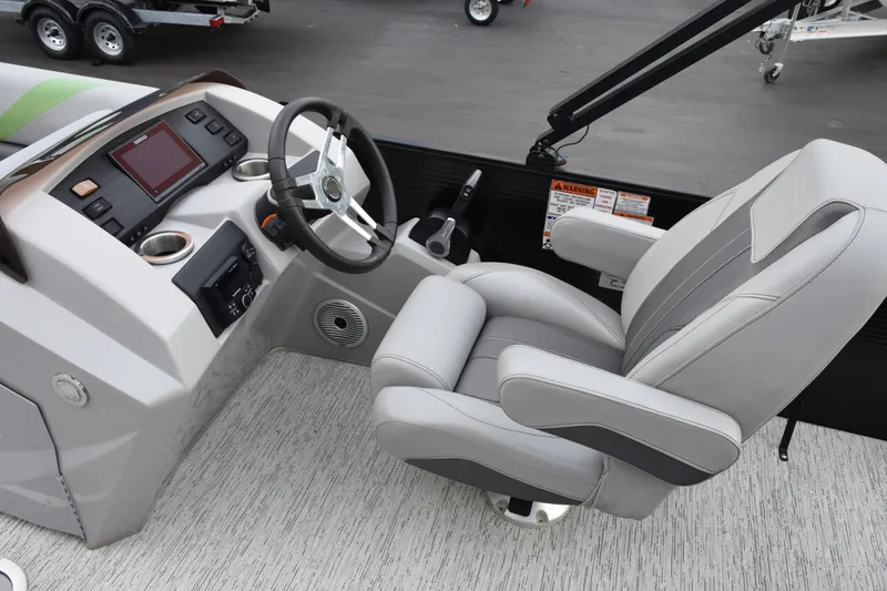 Slide: The Image of Captain's seat and helm of 2021 Bennington 24 SSBX pontoon boat, featuring modern controls. - 9