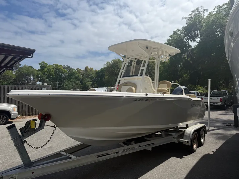 Slide: The Image of 2018 Key West 219 FS boat parked on trailer outdoors. - 8