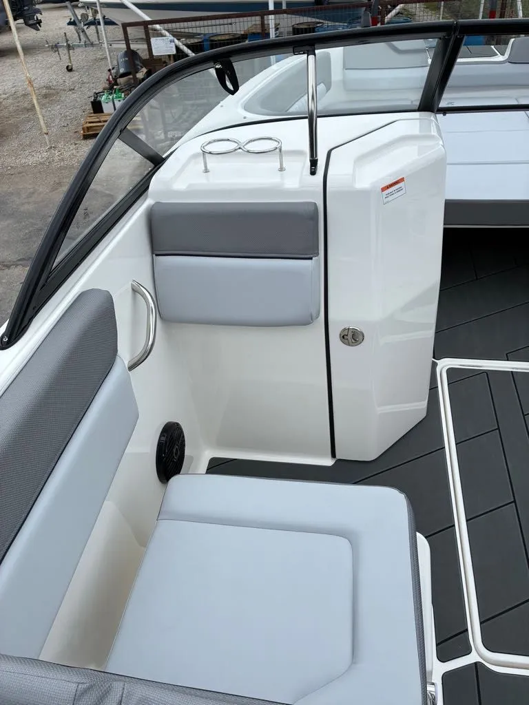 Slide: The Image of Interior of Bayliner D22 boat, 2026 model, featuring gray upholstery. - 9