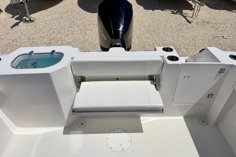 Slide: The Image of 2023 Aquasport 2200 Dual Console boat interior with seating and storage compartments. - 27